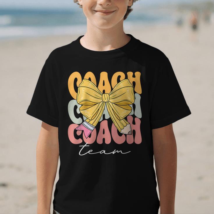 Coach Team Groovy Coquette Bow Cute Back To School Graphic Kid T-Shirt Coach Team Groovy Coquette Bow Cute Back To School Graphic Kid T-Shirt
