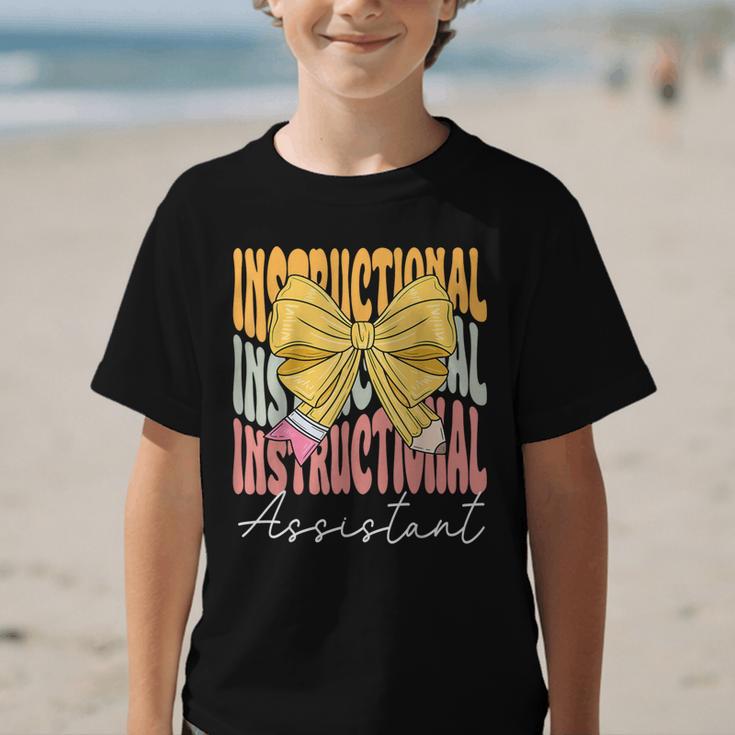 Instructional Assistant Groovy Coquette Bow Back To School Graphic Kid T-Shirt Instructional Assistant Groovy Coquette Bow Back To School Graphic Kid T-Shirt