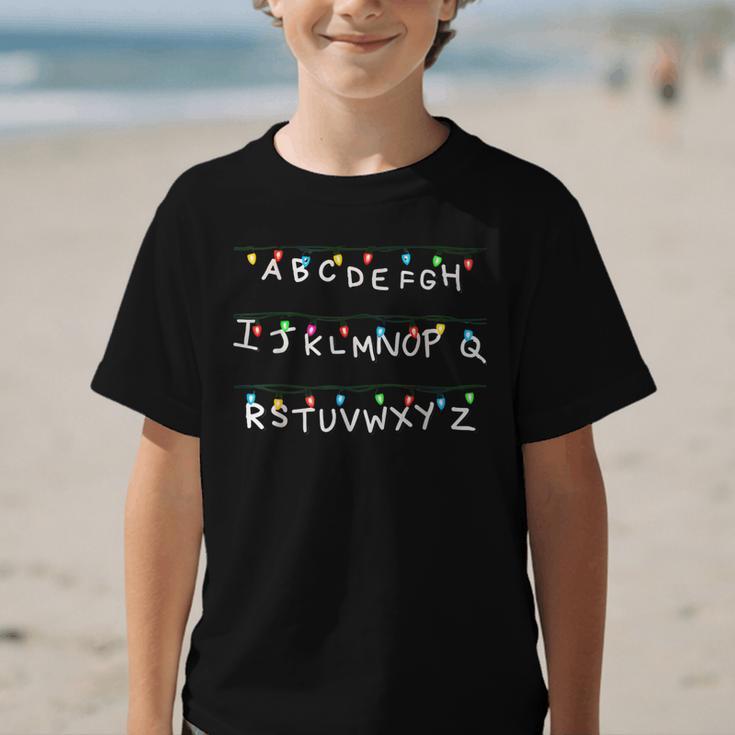 Stranger Wall Alphabet Lights Spooky Back To School Graphic Kid T-Shirt Stranger Wall Alphabet Lights Spooky Back To School Graphic Kid T-Shirt