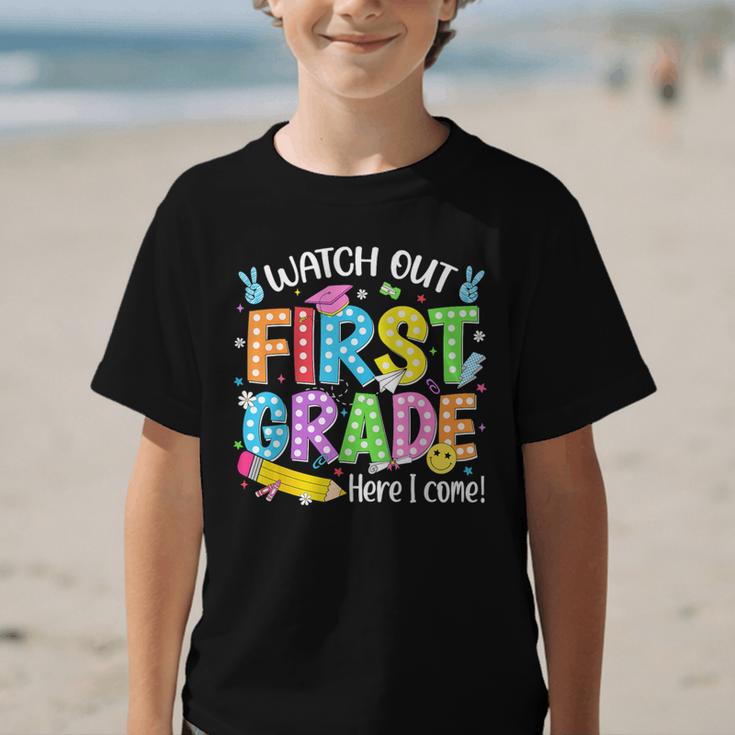 Watch Out First Grade Here I Come Back To School 1st Grade Graphic Kid T-Shirt Watch Out First Grade Here I Come Back To School 1st Grade Graphic Kid T-Shirt