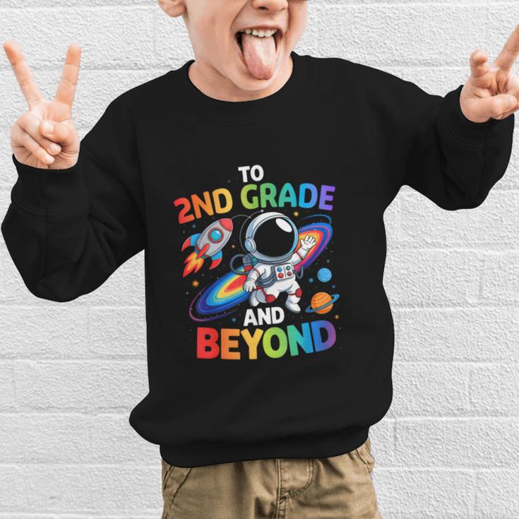 2nd Grade And Beyond Second Grade Astronaut Back To School Graphic Kid Sweatshirt 2nd Grade And Beyond Second Grade Astronaut Back To School Graphic Kid Sweatshirt