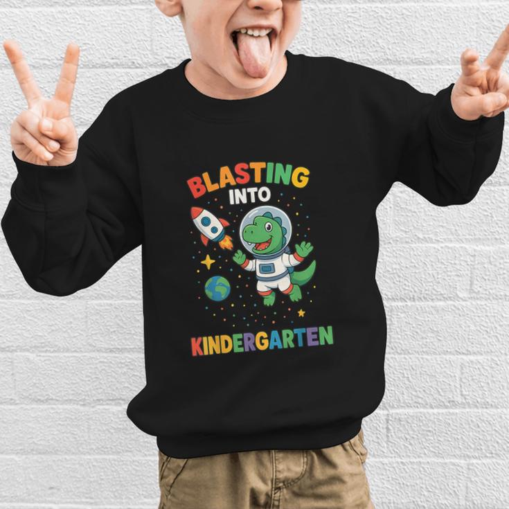 Blasting Into Kindergarten Dinosaur Astronaut Back To School Graphic Kid Sweatshirt Blasting Into Kindergarten Dinosaur Astronaut Back To School Graphic Kid Sweatshirt