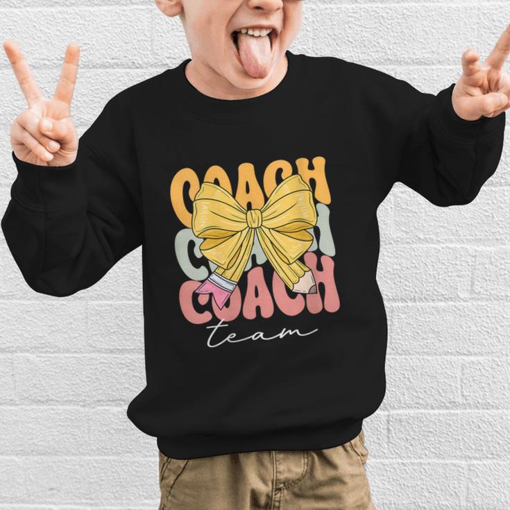 Coach Team Groovy Coquette Bow Cute Back To School Graphic Kid Sweatshirt Coach Team Groovy Coquette Bow Cute Back To School Graphic Kid Sweatshirt