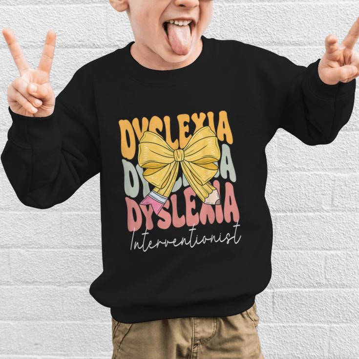 Dyslexia Interventionist Groovy Coquette Bow Back To School Graphic Kid Sweatshirt