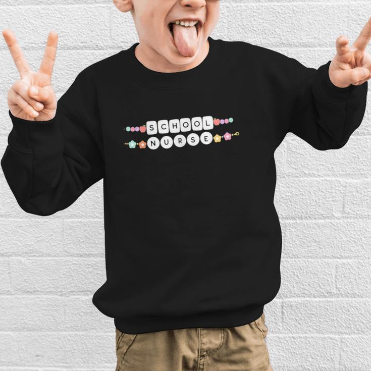 Friendship Bracelet School Nurse Appreciation Back To School Graphic Kid Sweatshirt Friendship Bracelet School Nurse Appreciation Back To School Graphic Kid Sweatshirt
