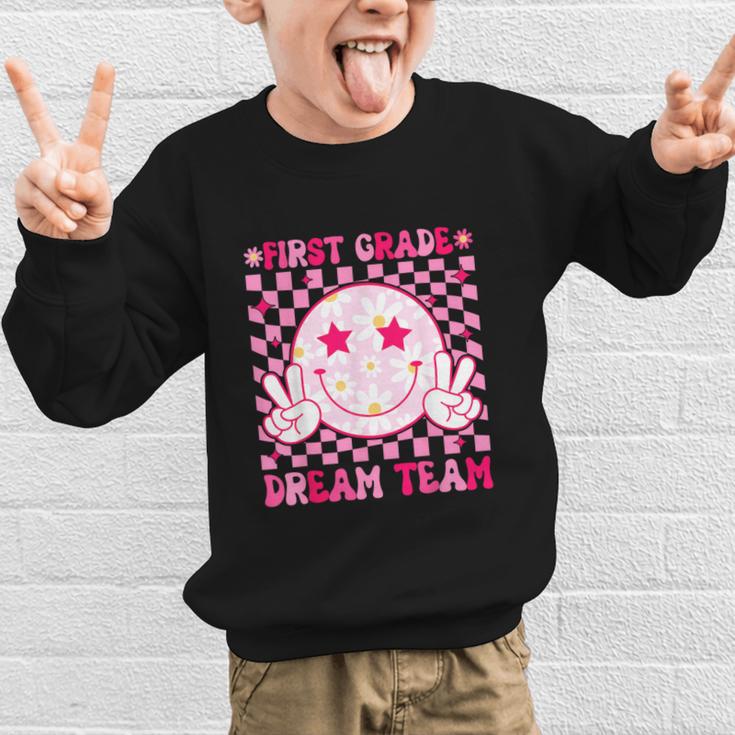 Groovy First Grade Dream Team Back To School 1st Grade Squad Graphic Kid Sweatshirt Groovy First Grade Dream Team Back To School 1st Grade Squad Graphic Kid Sweatshirt
