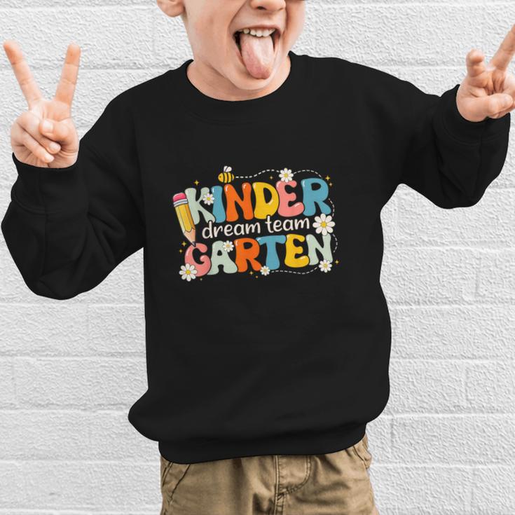 Kindergarten Dream Team Groovy Retro Children Back To School Graphic Kid Sweatshirt Kindergarten Dream Team Groovy Retro Children Back To School Graphic Kid Sweatshirt