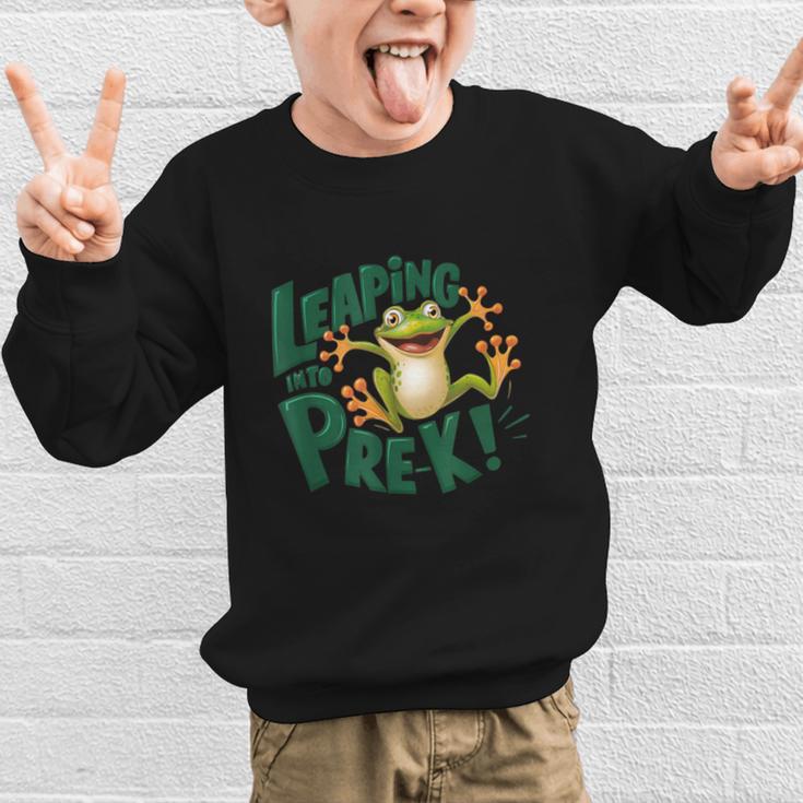 Leaping Into Pre-K Jumping Tree Frog Back To School Fun Graphic Kid Sweatshirt Leaping Into Pre-K Jumping Tree Frog Back To School Fun Graphic Kid Sweatshirt