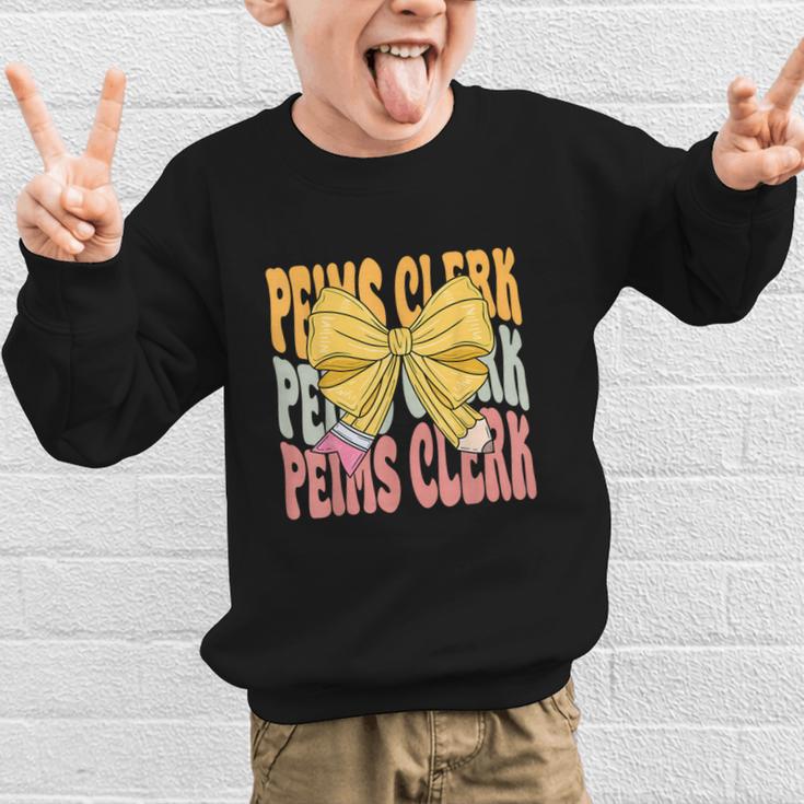 Peims Clerk Groovy Coquette Bow Cute Back To School Graphic Kid Sweatshirt Peims Clerk Groovy Coquette Bow Cute Back To School Graphic Kid Sweatshirt