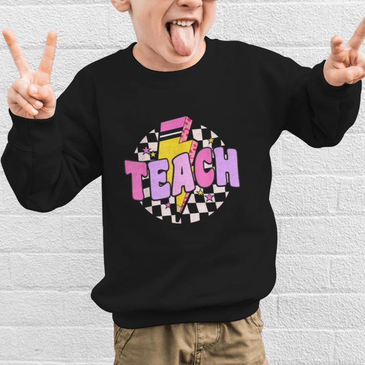 Retro Checkered Teach Pencil Lightning Back To School Graphic Kid Sweatshirt Retro Checkered Teach Pencil Lightning Back To School Graphic Kid Sweatshirt