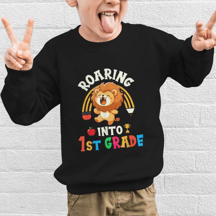 Roaring Into First Grade Lion 1st Grade Back To School Graphic Kid Sweatshirt Roaring Into First Grade Lion 1st Grade Back To School Graphic Kid Sweatshirt