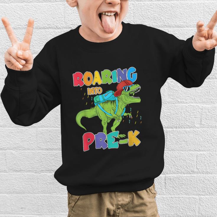 Roaring Into Pre-K Preschool Dinosaur Back To School Graphic Kid Sweatshirt Roaring Into Pre-K Preschool Dinosaur Back To School Graphic Kid Sweatshirt