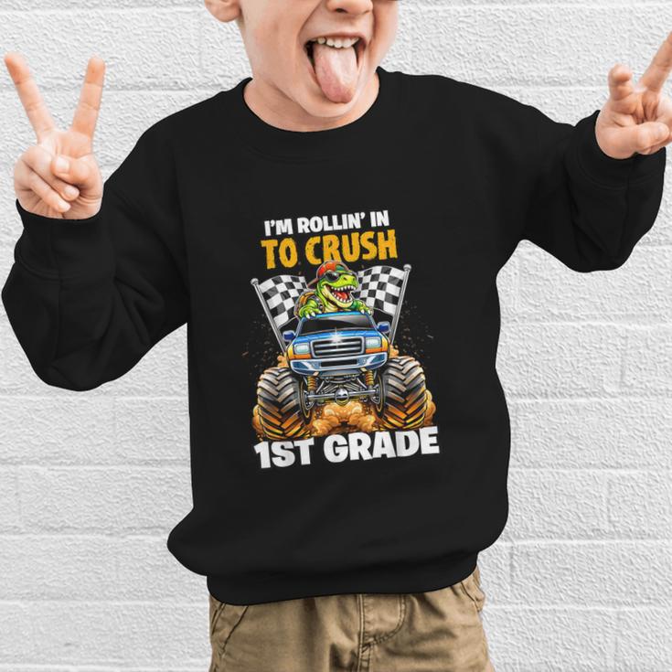 Rollin Crush Dinosaur Monster Truck Back To School 1st Grade Graphic Kid Sweatshirt Rollin Crush Dinosaur Monster Truck Back To School 1st Grade Graphic Kid Sweatshirt