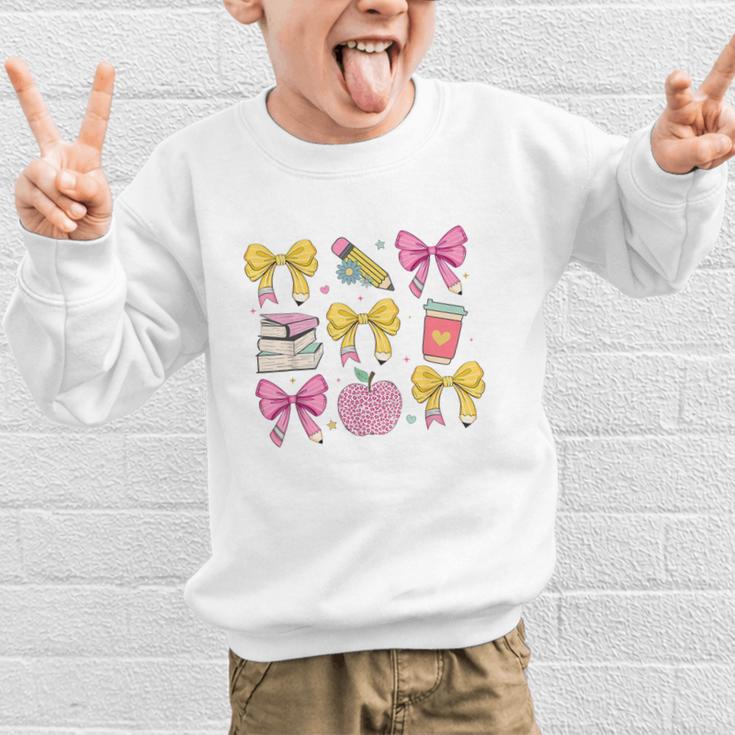 Apple Coquette Bow Books First Day Of School Back To School Graphic Kid Sweatshirt Apple Coquette Bow Books First Day Of School Back To School Graphic Kid Sweatshirt