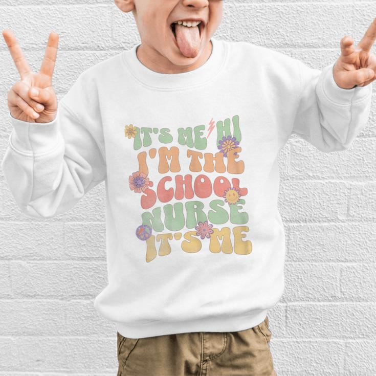 Back To School Nurse It's Me Hi I'm The School Nurse Graphic Kid Sweatshirt Back To School Nurse It's Me Hi I'm The School Nurse Graphic Kid Sweatshirt