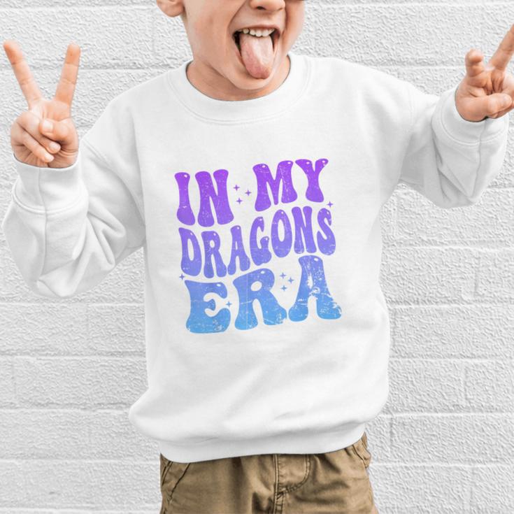 In My Dragons Era Back To School Spirit Game Retro Groovy Graphic Kid Sweatshirt In My Dragons Era Back To School Spirit Game Retro Groovy Graphic Kid Sweatshirt