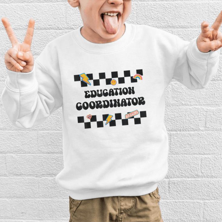 Education Coordinator Groovy Back To School Checkered Graphic Kid Sweatshirt Education Coordinator Groovy Back To School Checkered Graphic Kid Sweatshirt