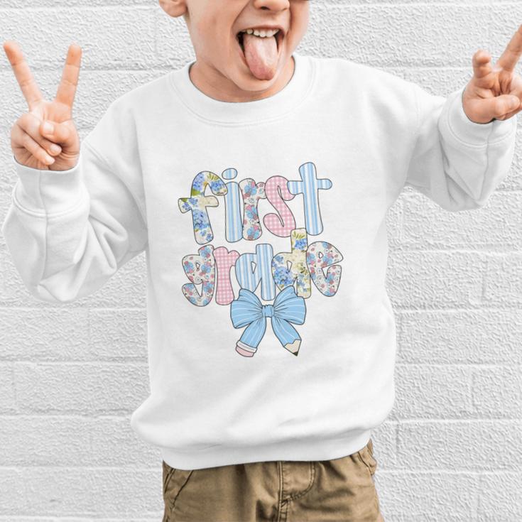 First Grade Coquette Bow Pencil First Day Back To School Performance Graphic Kid Sweatshirt First Grade Coquette Bow Pencil First Day Back To School Performance Graphic Kid Sweatshirt