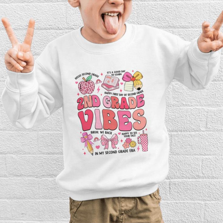 Girls 2nd Grade Vibes Coquette Pink Bow Back To School Graphic Kid Sweatshirt Girls 2nd Grade Vibes Coquette Pink Bow Back To School Graphic Kid Sweatshirt