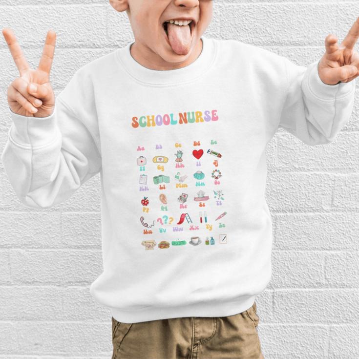 Groovy Cute ABC School Nurse Alphabet Back To School Women Graphic Kid Sweatshirt Groovy Cute ABC School Nurse Alphabet Back To School Women Graphic Kid Sweatshirt