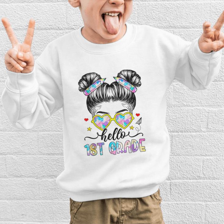 Hello 1st Grade Messy Bun Girl Back To School First Day Graphic Kid Sweatshirt Hello 1st Grade Messy Bun Girl Back To School First Day Graphic Kid Sweatshirt