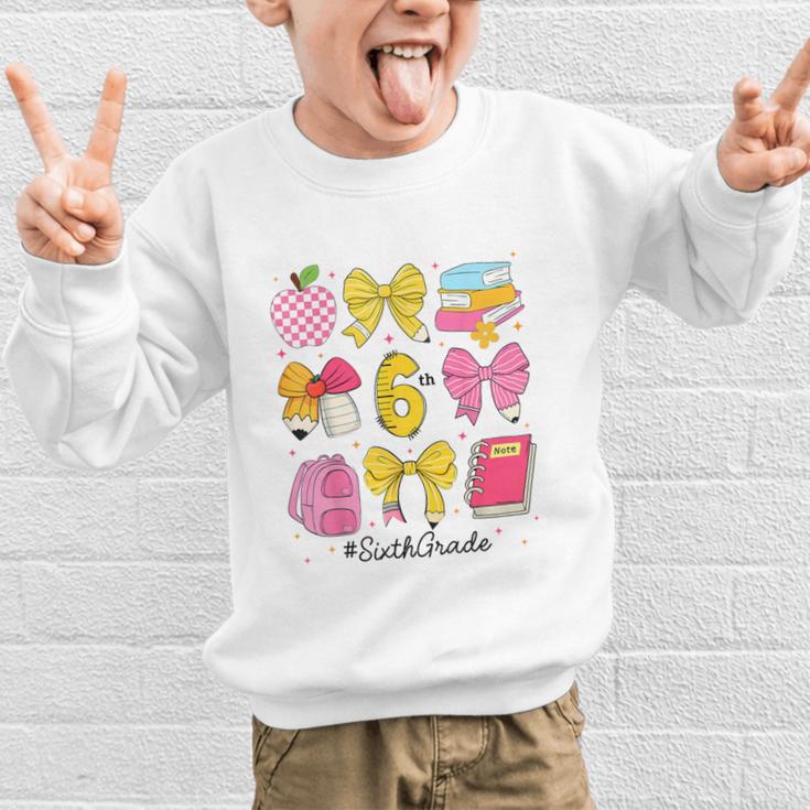 Hello Sixth 6th Grade Back To School Coquette Bow Girls Graphic Kid Sweatshirt Hello Sixth 6th Grade Back To School Coquette Bow Girls Graphic Kid Sweatshirt