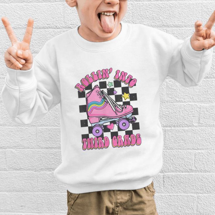 Kids Back To School Skating Rollin Into Third 3rd Grade Graphic Kid Sweatshirt Kids Back To School Skating Rollin Into Third 3rd Grade Graphic Kid Sweatshirt