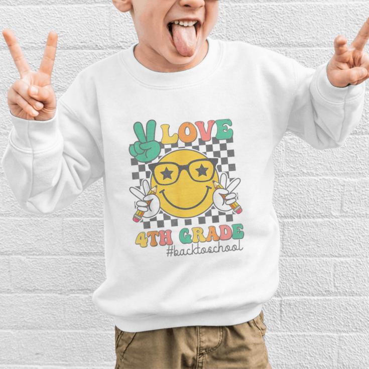 Peace Love 4th Grade Cute Smile Face Back To School Girls Graphic Kid Sweatshirt Peace Love 4th Grade Cute Smile Face Back To School Girls Graphic Kid Sweatshirt