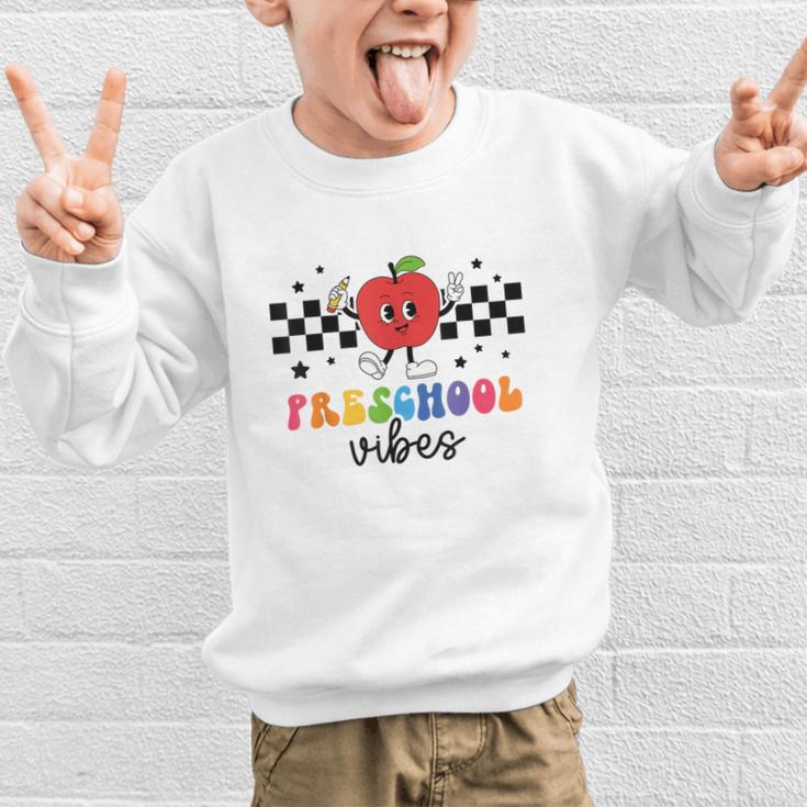 Preschool Vibes Retro Groovy Apple Back To School Graphic Kid Sweatshirt Preschool Vibes Retro Groovy Apple Back To School Graphic Kid Sweatshirt