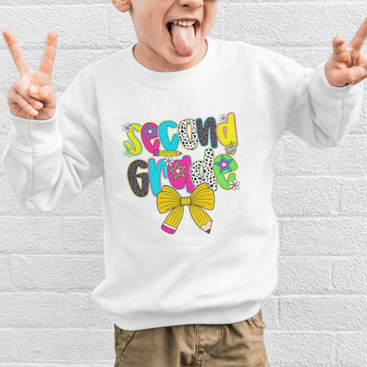 Second Grade Coquette Bow First Day Of School Back To School Performance Graphic Kid Sweatshirt Second Grade Coquette Bow First Day Of School Back To School Performance Graphic Kid Sweatshirt