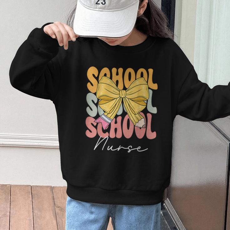 School Nurse Groovy Coquette Bow Cute Back To School Graphic Kid Sweatshirt School Nurse Groovy Coquette Bow Cute Back To School Graphic Kid Sweatshirt