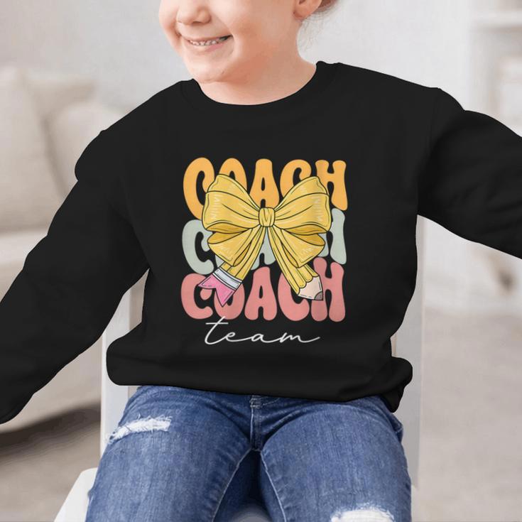 Coach Team Groovy Coquette Bow Cute Back To School Graphic Kid Sweatshirt Coach Team Groovy Coquette Bow Cute Back To School Graphic Kid Sweatshirt