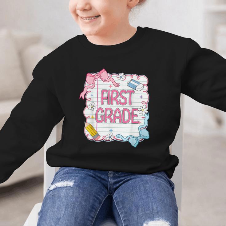 First Grade Back To School Girls Kids Coquette Bows Retro Graphic Kid Sweatshirt First Grade Back To School Girls Kids Coquette Bows Retro Graphic Kid Sweatshirt