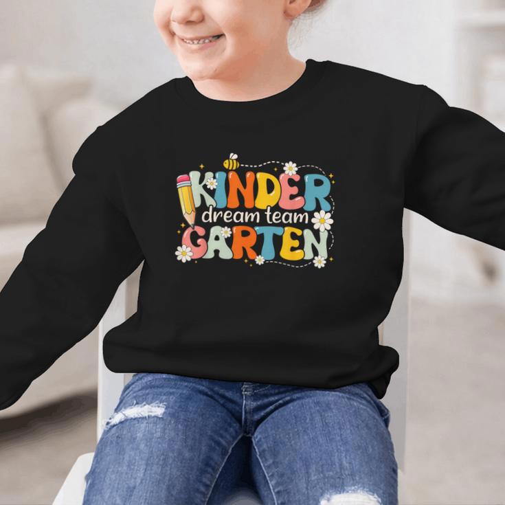 Kindergarten Dream Team Groovy Retro Children Back To School Graphic Kid Sweatshirt Kindergarten Dream Team Groovy Retro Children Back To School Graphic Kid Sweatshirt