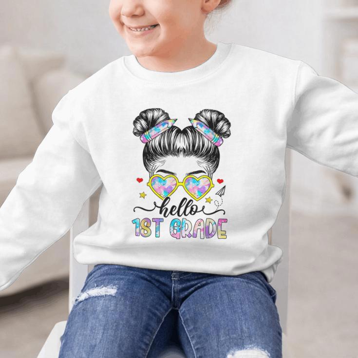 Hello 1st Grade Messy Bun Girl Back To School First Day Graphic Kid Sweatshirt Hello 1st Grade Messy Bun Girl Back To School First Day Graphic Kid Sweatshirt