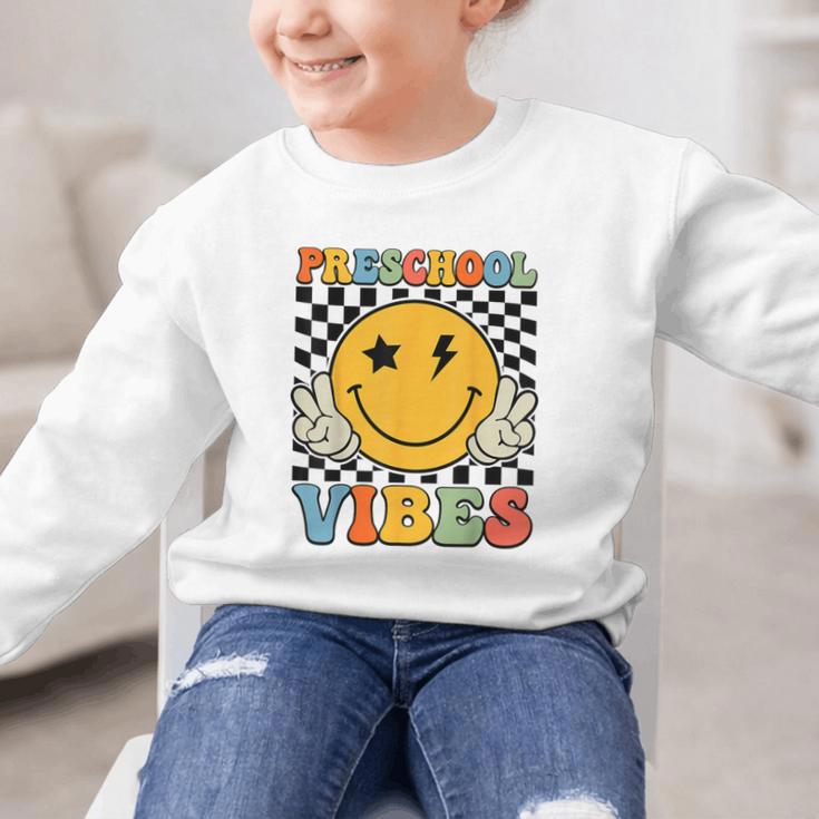 Preschool Vibes Retro Groovy Back To School Pre-K Graphic Kid Sweatshirt Preschool Vibes Retro Groovy Back To School Pre-K Graphic Kid Sweatshirt