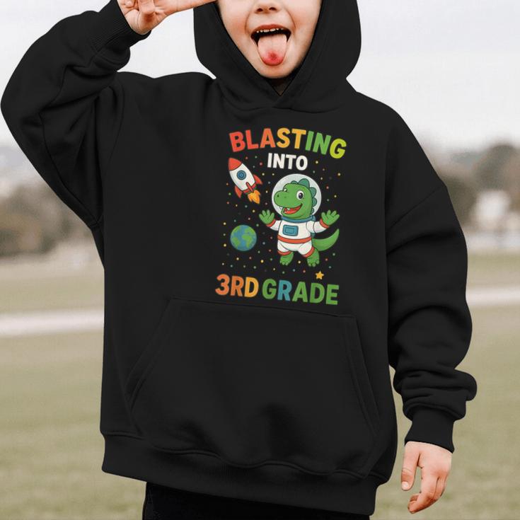 Blasting Into 3rd Grade Dinosaur Astronaut Back To School Graphic Kid Hoodie Blasting Into 3rd Grade Dinosaur Astronaut Back To School Graphic Kid Hoodie