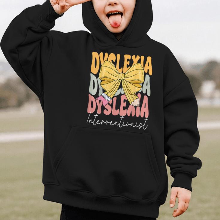 Dyslexia Interventionist Groovy Coquette Bow Back To School Graphic Kid Hoodie Dyslexia Interventionist Groovy Coquette Bow Back To School Graphic Kid Hoodie