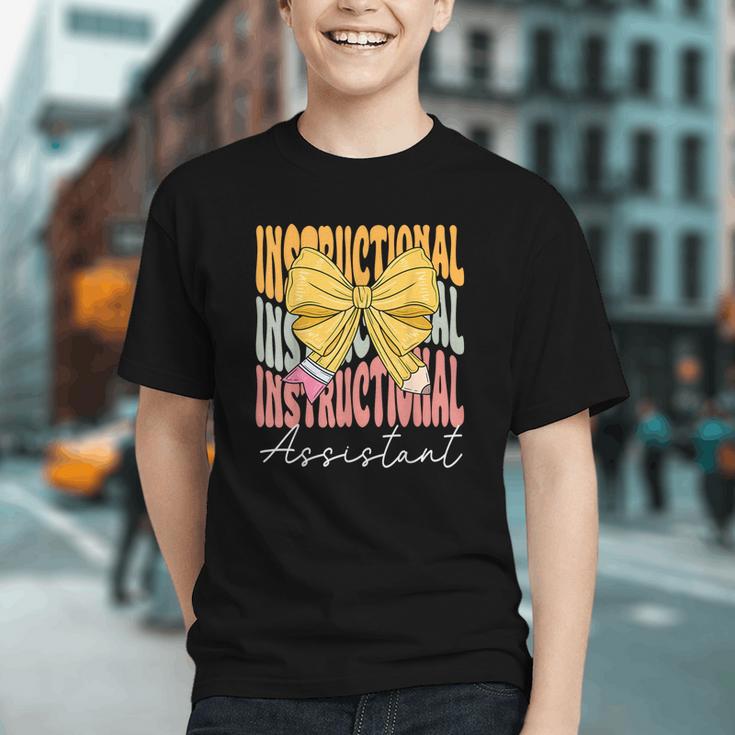 Groovy Instructional Assistant Coquette Bow Back to School Youth T-Shirt Groovy Instructional Assistant Coquette Bow Back to School Youth T-Shirt