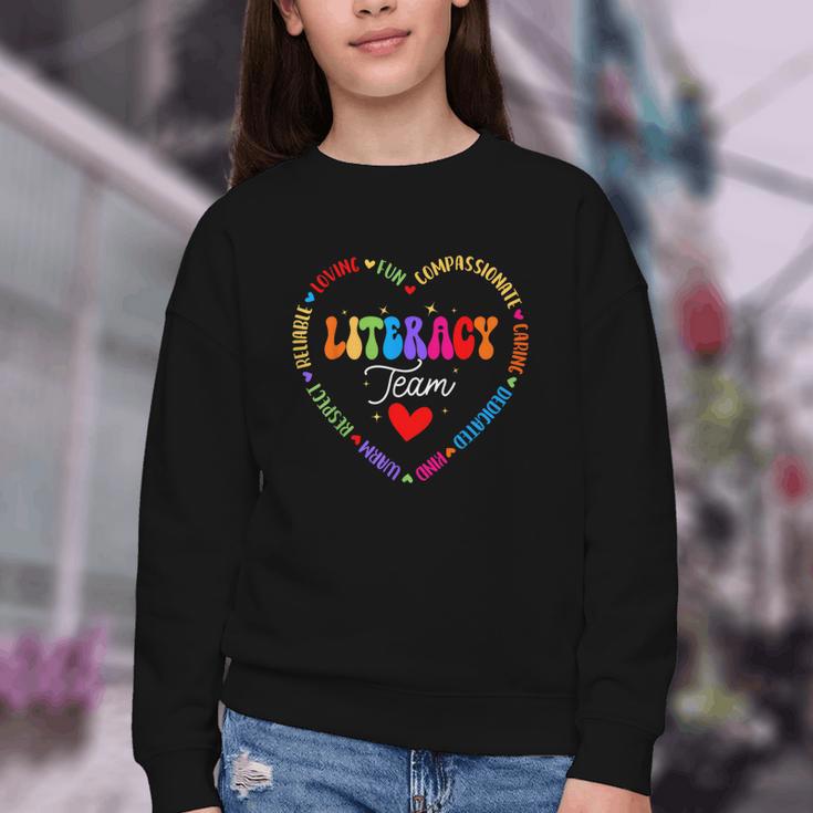Groovy Literacy Team Reading Appreciation Back To School Youth Crewneck Sweatshirt Groovy Literacy Team Reading Appreciation Back To School Youth Crewneck Sweatshirt