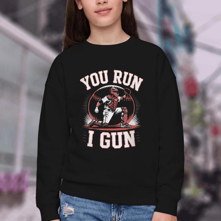 You Run I Gun Baseball Catcher Softball Player Youth Crewneck Sweatshirt You Run I Gun Baseball Catcher Softball Player Youth Crewneck Sweatshirt