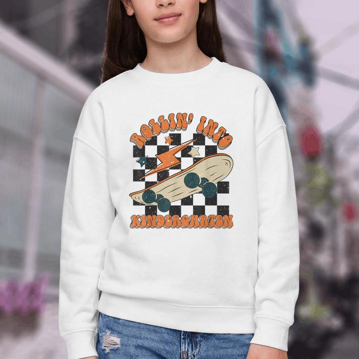 Rolling Into Kindergarten Retro Groovy Back To School Kids Youth Crewneck Sweatshirt
