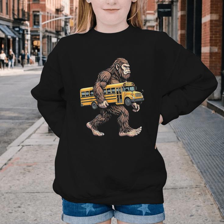 Bigfoot Carrying School Bus Sasquatch Back To School Youth Crewneck Sweatshirt Bigfoot Carrying School Bus Sasquatch Back To School Youth Crewneck Sweatshirt