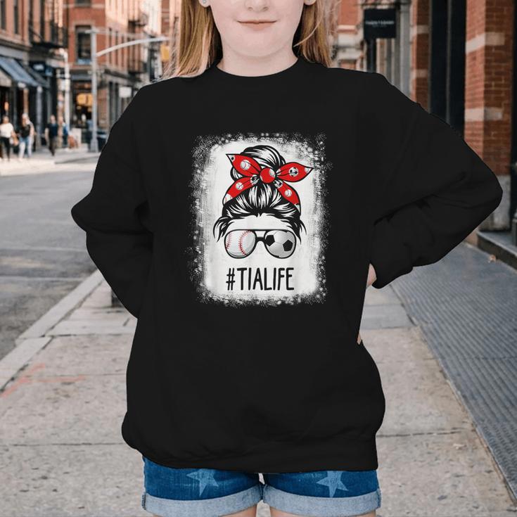 Bleached Tia Life Soccer Messy Bun Baseball Game Day Youth Crewneck Sweatshirt Bleached Tia Life Soccer Messy Bun Baseball Game Day Youth Crewneck Sweatshirt