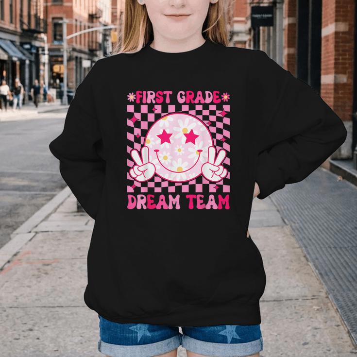 Groovy First Grade Dream Team Back To School 1st Grade Squad Youth Crewneck Sweatshirt Groovy First Grade Dream Team Back To School 1st Grade Squad Youth Crewneck Sweatshirt