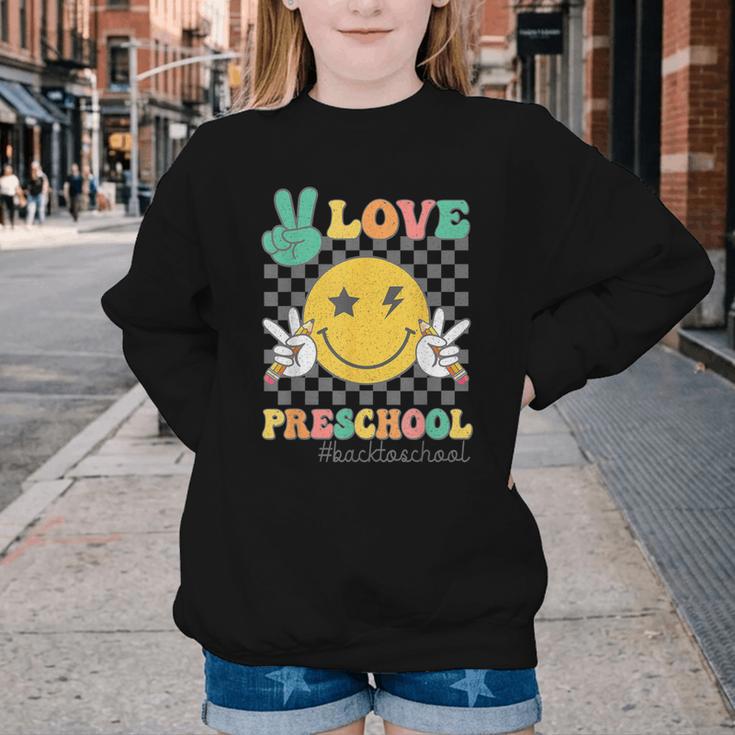 Peace Love Preschool Smile Face Back To School PRESCHOOL Youth Crewneck Sweatshirt Peace Love Preschool Smile Face Back To School PRESCHOOL Youth Crewneck Sweatshirt