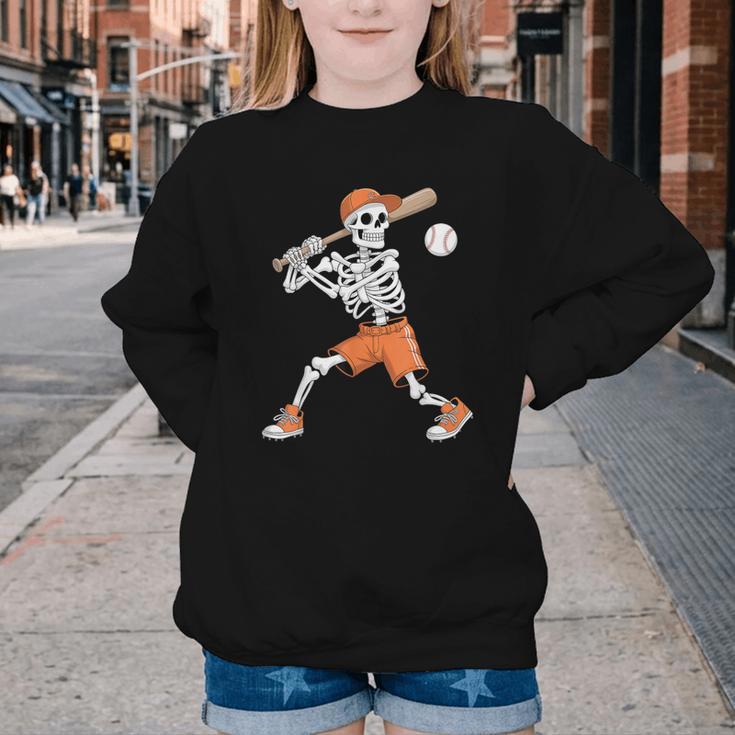 Skeleton Batting Baseball Halloween Youth Crewneck Sweatshirt Skeleton Batting Baseball Halloween Youth Crewneck Sweatshirt