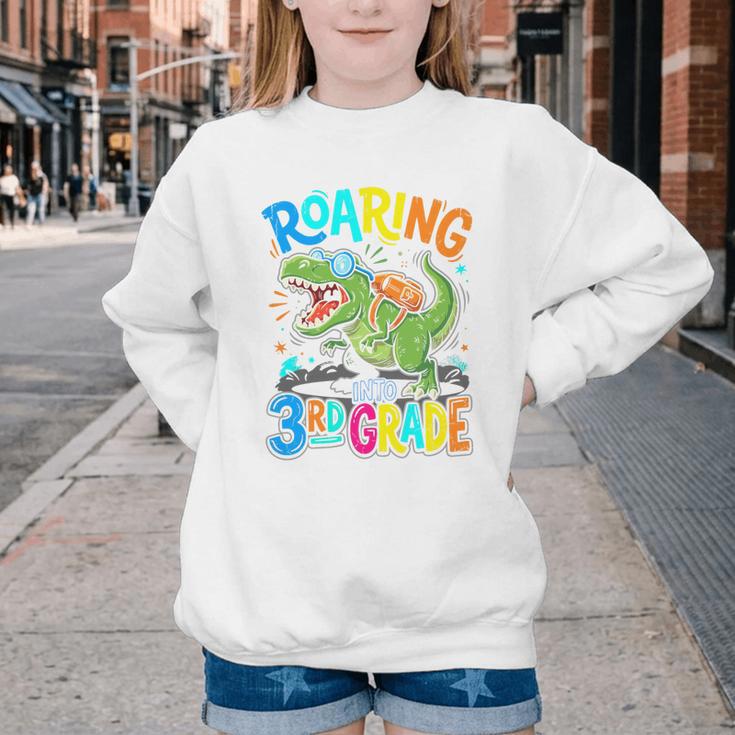 Roaring Into 3rd Grade Back To School Dinosaurus T-Rex Premium Tri-Blend Youth Crewneck Sweatshirt