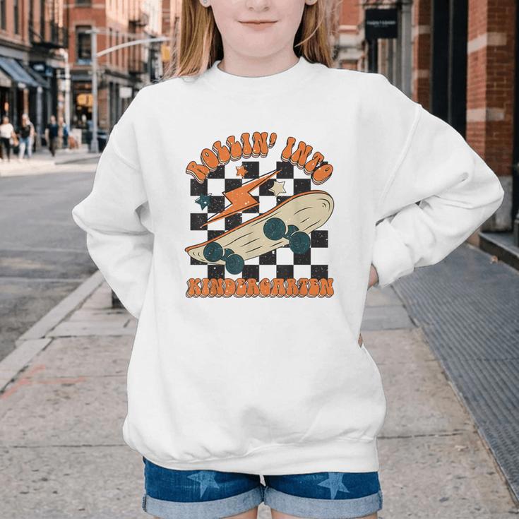 Rolling Into Kindergarten Retro Groovy Back To School Kids Youth Crewneck Sweatshirt