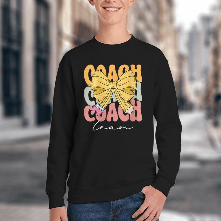 Coach Team Groovy Coquette Bow Cute Back To School Youth Crewneck Sweatshirt Coach Team Groovy Coquette Bow Cute Back To School Youth Crewneck Sweatshirt